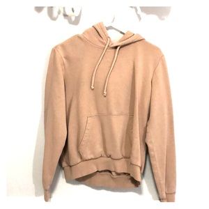 Woman’s rose colored hoodie